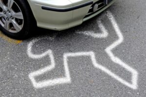 CrimeSceneChalkOutlineOfAVictimUnderAWheel