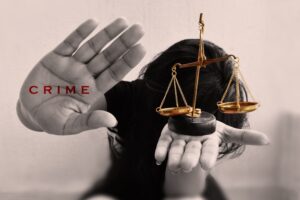 WomenHoldingJusticeBalanceInOneHandWithCrimeWritten
