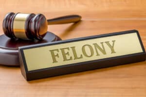 AGavelAndANamePlateWithTheEngravingFelony