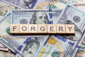 TheWordForgeryOnDollarUsaBackground